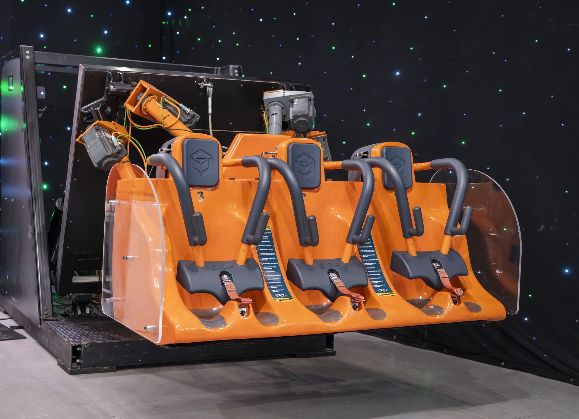 Close view of the VR360 motion simulator arms and three-seat cabin